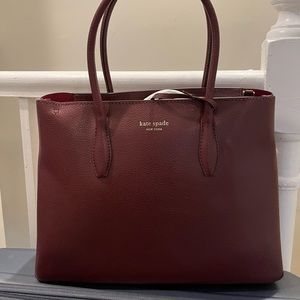 NWT Burgundy Kate spade bag for sale.